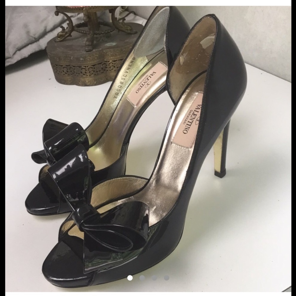 Black Valentino opened toe heels with black bow.